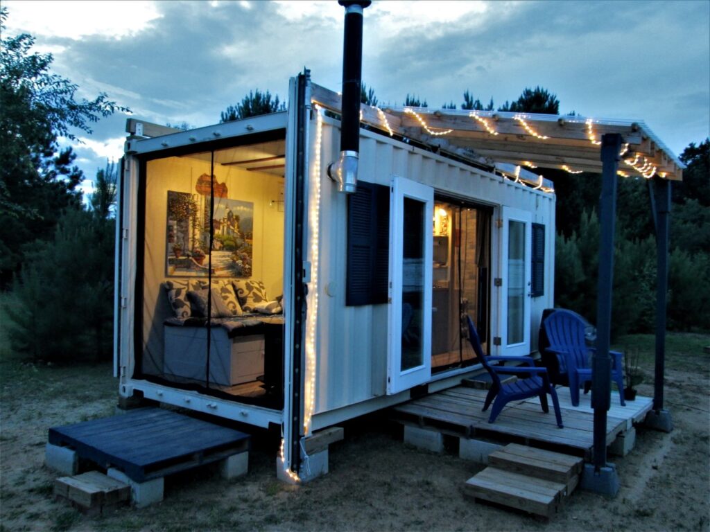 Tiny House Container Cabin with Wood Stove and Covered Porch.