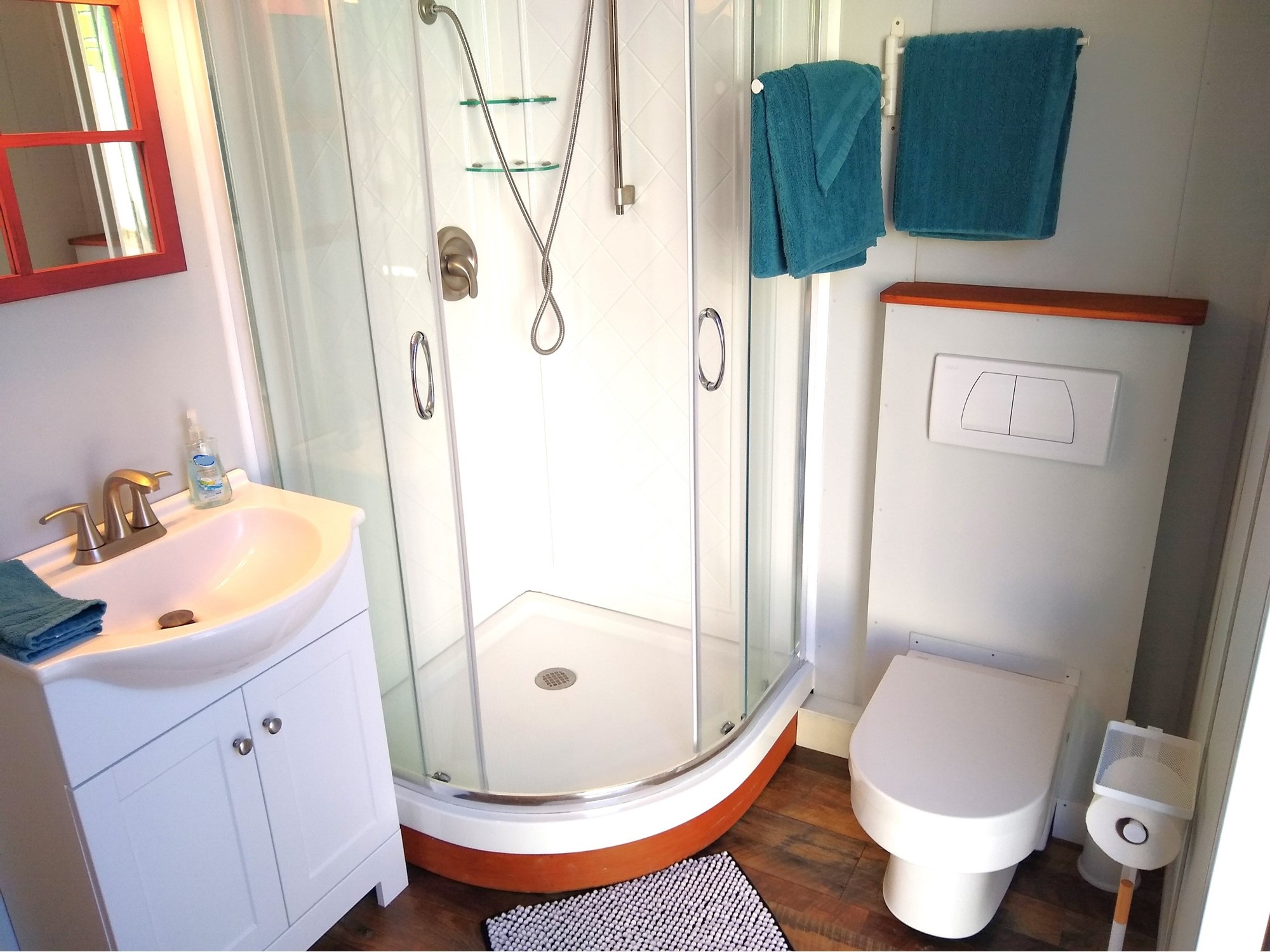 Over-sized bathroom with a modern flushing toilet